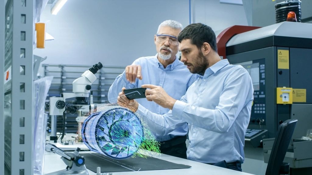 Engineers in laboratory inspecting circuit board